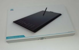 A boxed as new Huion New 1060 Plus Graphics Drawing Tablet. 10 x 6.25inch Digital Drawing tablet