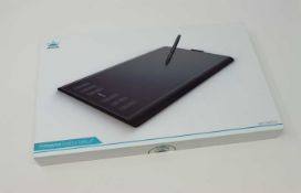 A boxed as new Huion New 1060 Plus Graphics Drawing Tablet. 10 x 6.25inch Digital Drawing tablet