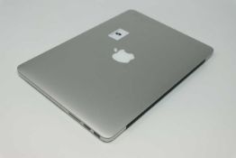 A pre-owned MacBook Pro Retina A1502 sold for parts (Serial: C02S3KRFYFVH5) (Powers on and displays.