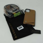 An as new Bandolier Leather Crossbody Case for iPhone 11 in Beige/Black with an as new Bandolier