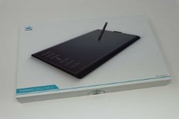 A boxed as new Huion New 1060 Plus Graphics Drawing Tablet. 10 x 6.25inch Digital Drawing tablet