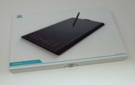 A boxed as new Huion New 1060 Plus Graphics Drawing Tablet. 10 x 6.25inch Digital Drawing tablet