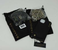 An as new Bandolier Emma Pebble Leather Crossbody Case for iPhone X/XS in Black/Pewter with an as