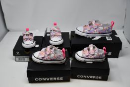 Four pairs of toddler Converse CTAS 2V Lo Unicorn trainers (UK 2, 5, 6, 10).