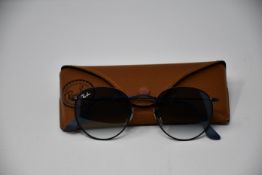 A pair of as new Ray Ban sunglasses.