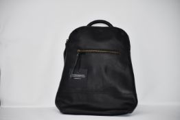 An as new Able small black leather backpack.