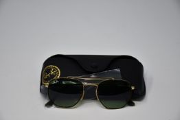 A pair of as new Ray Ban sunglasses.