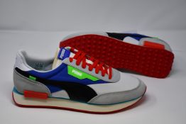 A pair of as new Puma Future rider Ride On trainers (UK 12).