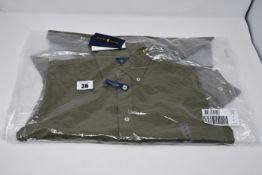An as new Ralph Lauren green knit Oxford long sleeved shirt (Size S).