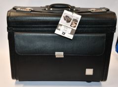 An as new Monolith leather look rolling Pilots case in black.