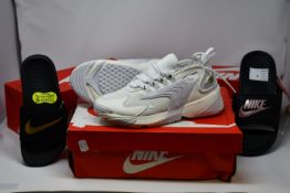 A pair of as new Nike Zoom 2K trainers (UK 6) and two pairs of Nike sliders(UK 3.5 and 6.5).