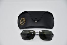 A pair of as new Ray Ban sunglasses.