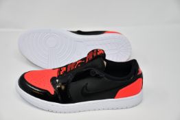 Two pairs of women's Nike Air Jordan 1 low slip trainers (UK 7 and 7.5).
