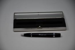 A Snap On ballpoint pen in black and silver with presentation case.