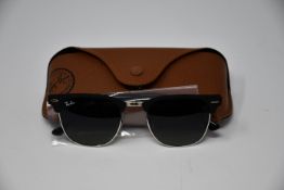 A pair of as new Ray Ban sunglasses.