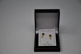 Three pairs of boxed as new Paula Bolton Vermeer earrings (9142).