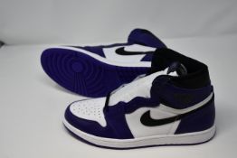 A pair of as new Nike Air Jordan 1 retro high court trainers (UK 10).