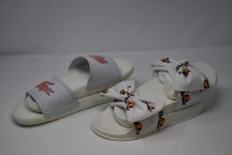 Seven pairs of assorted sliders/flip-flops to include Lacoste, Nike, Adidas, Ellesse and Havainas.