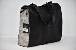 An as new Able Axum tote in snake/black.