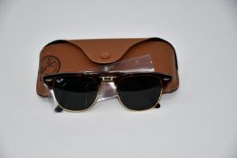 A pair of as new Ray Ban sunglasses.