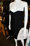 An Escada couture strapless knee length bodycon fully ruched dress (Size 38?).