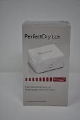 Two boxed as new PerfectDry LUX dry & disinfect Hearing Aids.