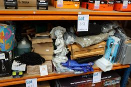 A quantity of miscellaneous items to include a Philips Sonicare tooth brush, garden ornament and Net