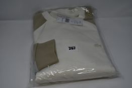 An as new Lacoste sweatshirt in cream/beige (US XL/FR 6 - RRP £150).