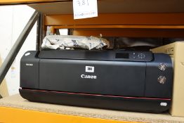 A pre-owned Canon PRO-1000 Inkjet Printer (Significant damage, sold for parts only).