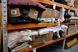 A quantity of miscellaneous cushions, covers, throws and related items.