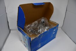 A pair of as new Tesi 2 - hole bath filler rim mounted chrome taps (Box unsealed and damaged).