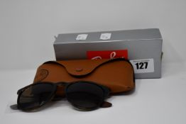 A pair of as new Ray Ban sunglasses.