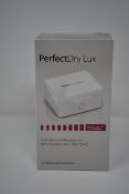Two boxed as new PerfectDry LUX dry & disinfect Hearing Aids.
