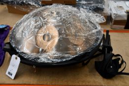 An as new Novapans hand drum, approximately 23inches across with carry case.