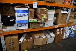 Two shelves of miscellaneous stationery and related items.