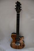 One as new Godin xtSA Koa electric guitar with bag.