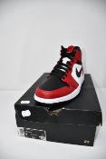 A pair of as new Nike Air Jordan 1 Mid sneakers (UK 8).