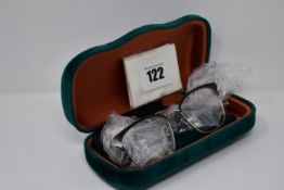 A pair of as new Gucci glasses frames with clear glass.