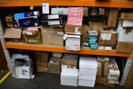 Two shelves of miscellaneous stationery and related items.