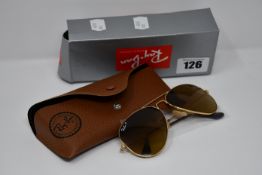 A pair of as new Ray Ban sunglasses.