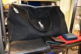 A pre-owned Ralph Lauren bag and eight pre-owned branded purses/wallets.