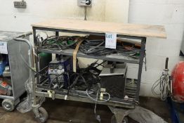 A pre-owned CUT-312 DC inverter Mig with feed unit and trolley on wheels.