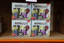Twelve NutriBullet deluxe upgrade kits.