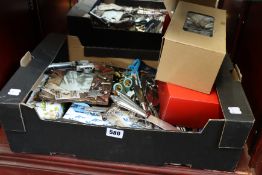 A box of assorted sharps and miscellaneous items to include scissors, knives, darts and picture