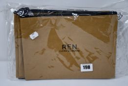 A quantity of Ren clean skincare cosmetic bags.