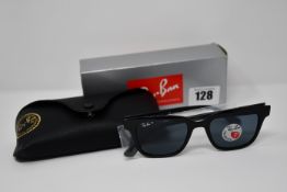 A pair of as new Ray Ban sunglasses.