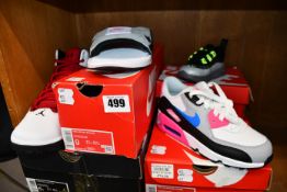 A pair of Nike Air Max Axis TDLR (UK 2.5), a pair of Nike Air Max 90 LTR (PS) (UK 1.5), a pair of