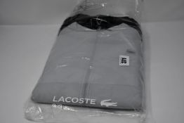 An as new Lacoste track top (US M/FR 4 - RRP £190).