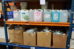 Two shelves of miscellaneous hand wash/sanitizer and related items.