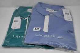 Two as new Lacoste polo shirts (Both US L/FR 5 - RRP £90 each).